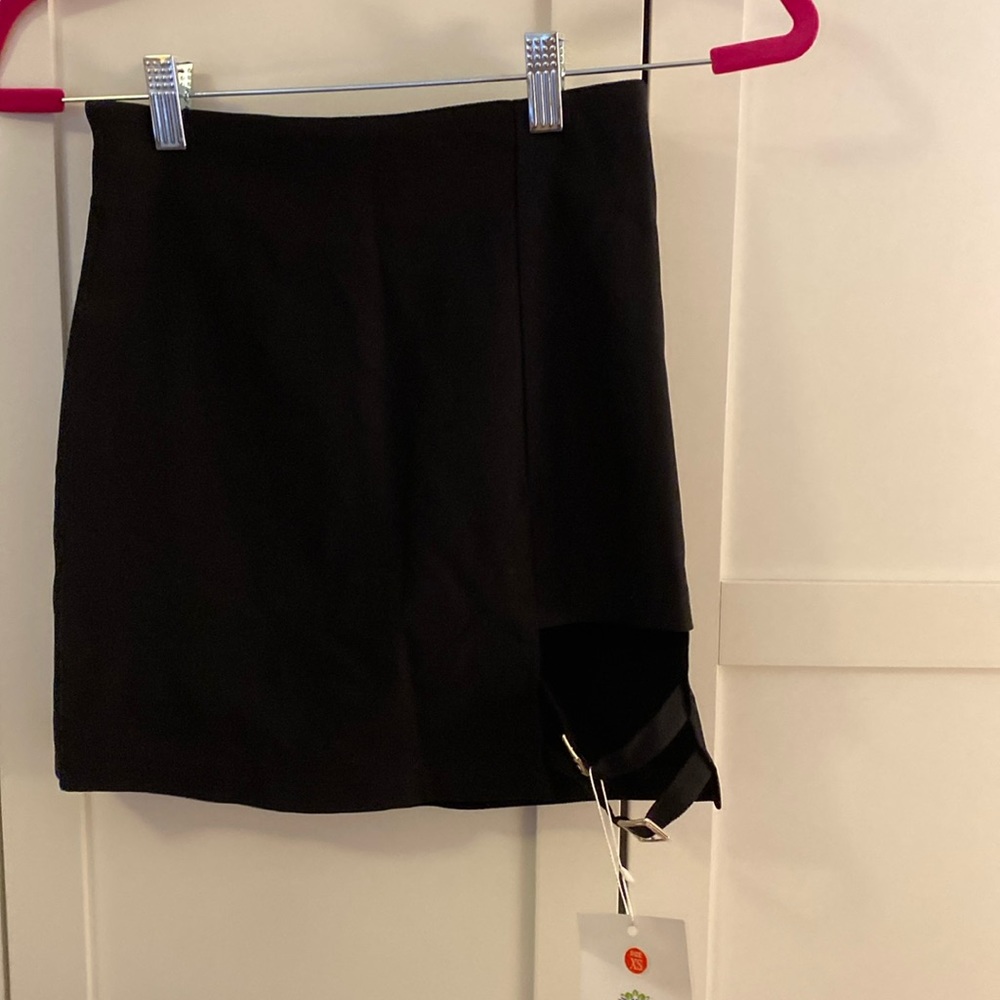 XS black mini skirt with cut out and silver buckle detail